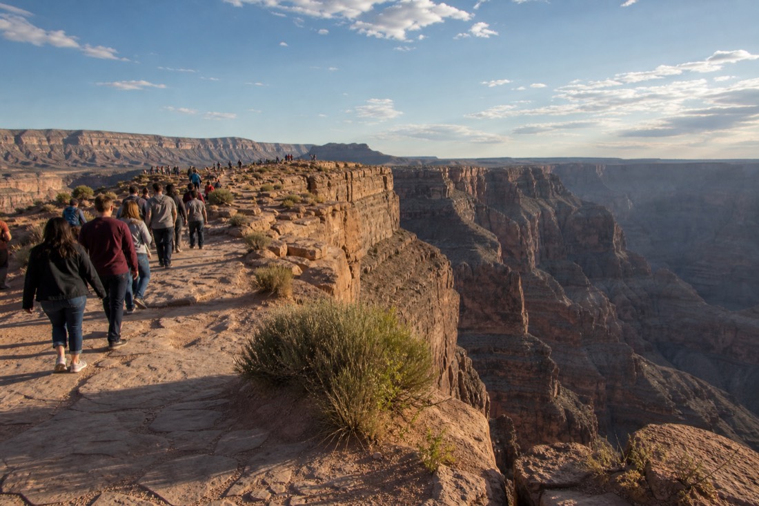 Visitors walking the rim path at Grand Canyon West near the Skywalk on Hualapai land